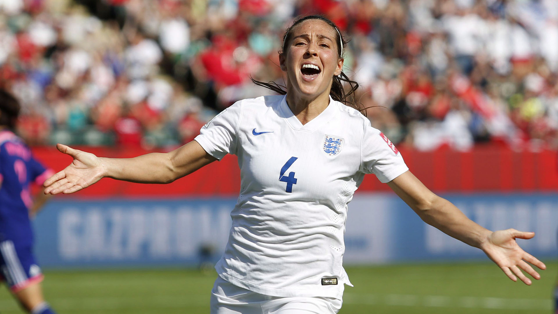 Fara Williams celebrating scoring a goal for England in 2015