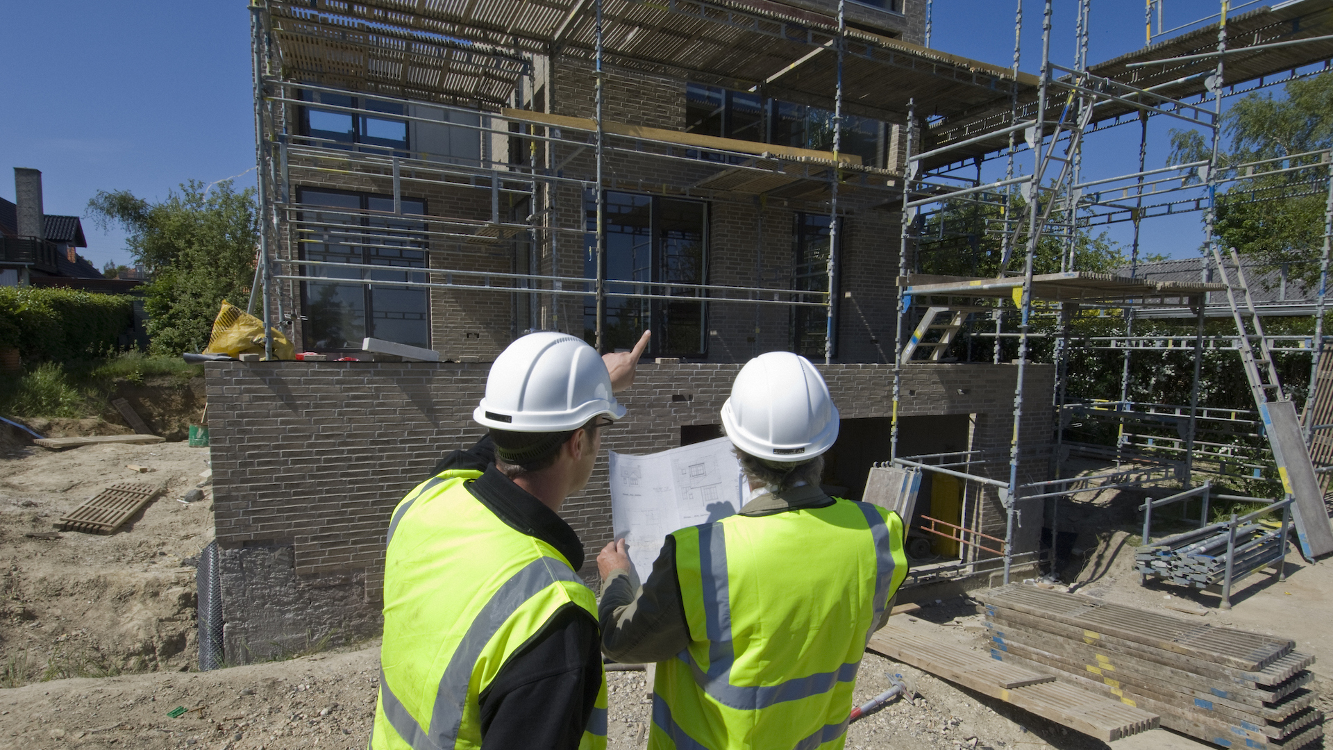 Architects surveying plans