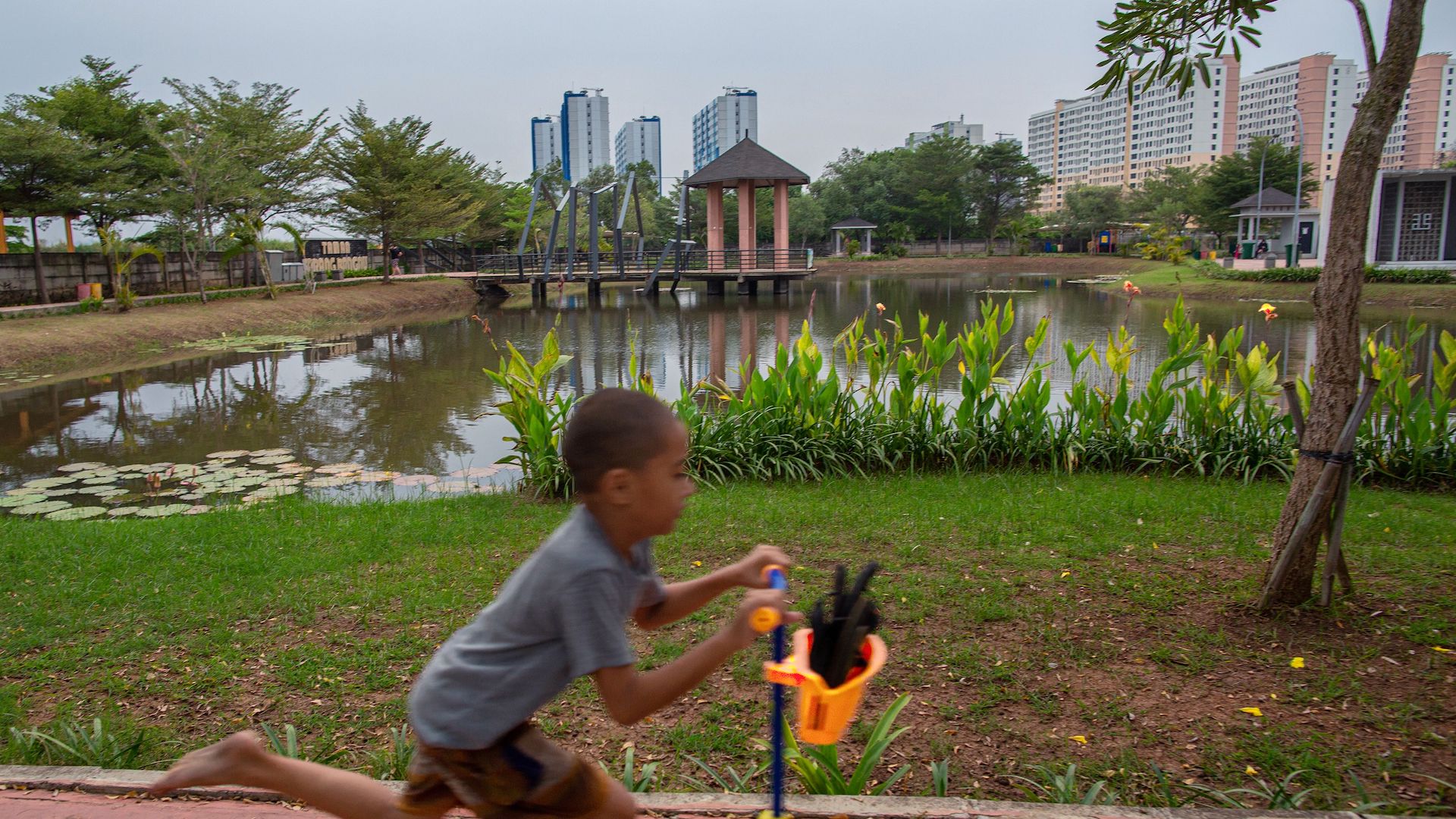Children playing on the playground at green-blue open space in Jakarta on 13 July 2023.