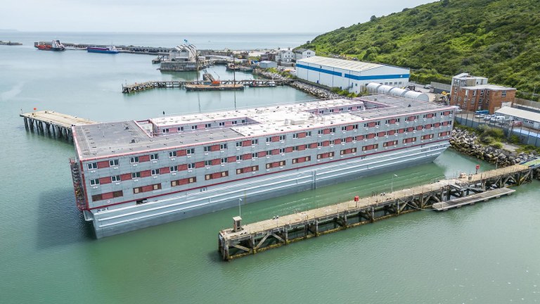 An aerial view of the Bibby Stockholm migrant asylum docked in its final position at Portland Port in Dorset.