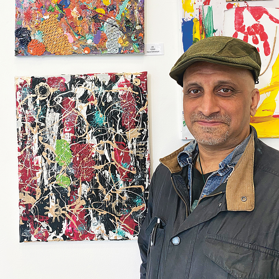 Dave Sohanpal with one of his paintings