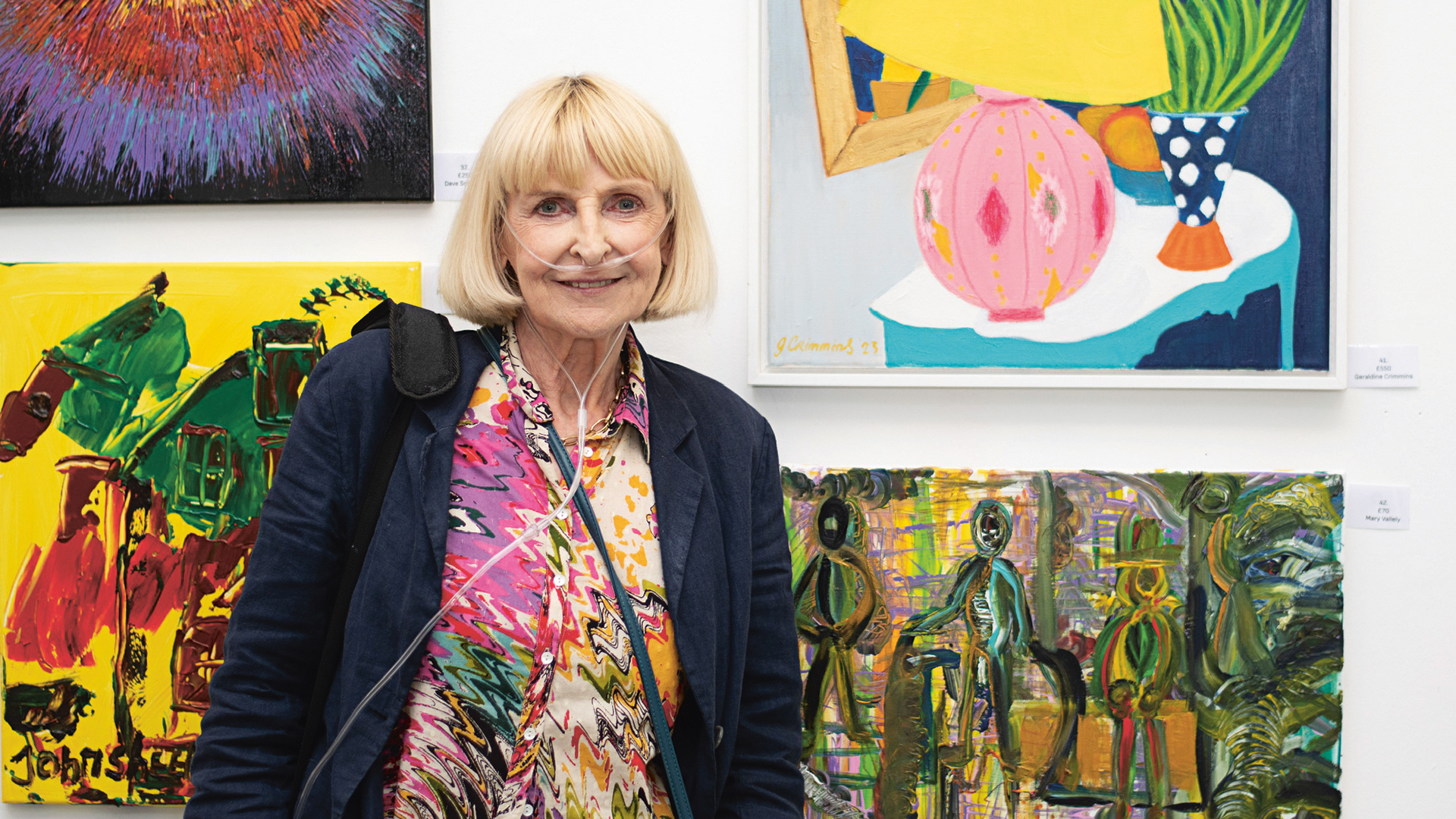 Geraldine Crimmins beside some of her artworks