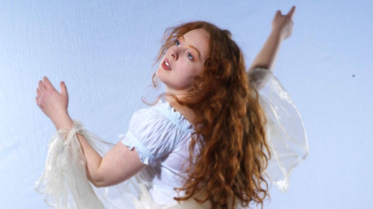 Ruby McCollister in a flowing white gown, for her Edinburgh debut