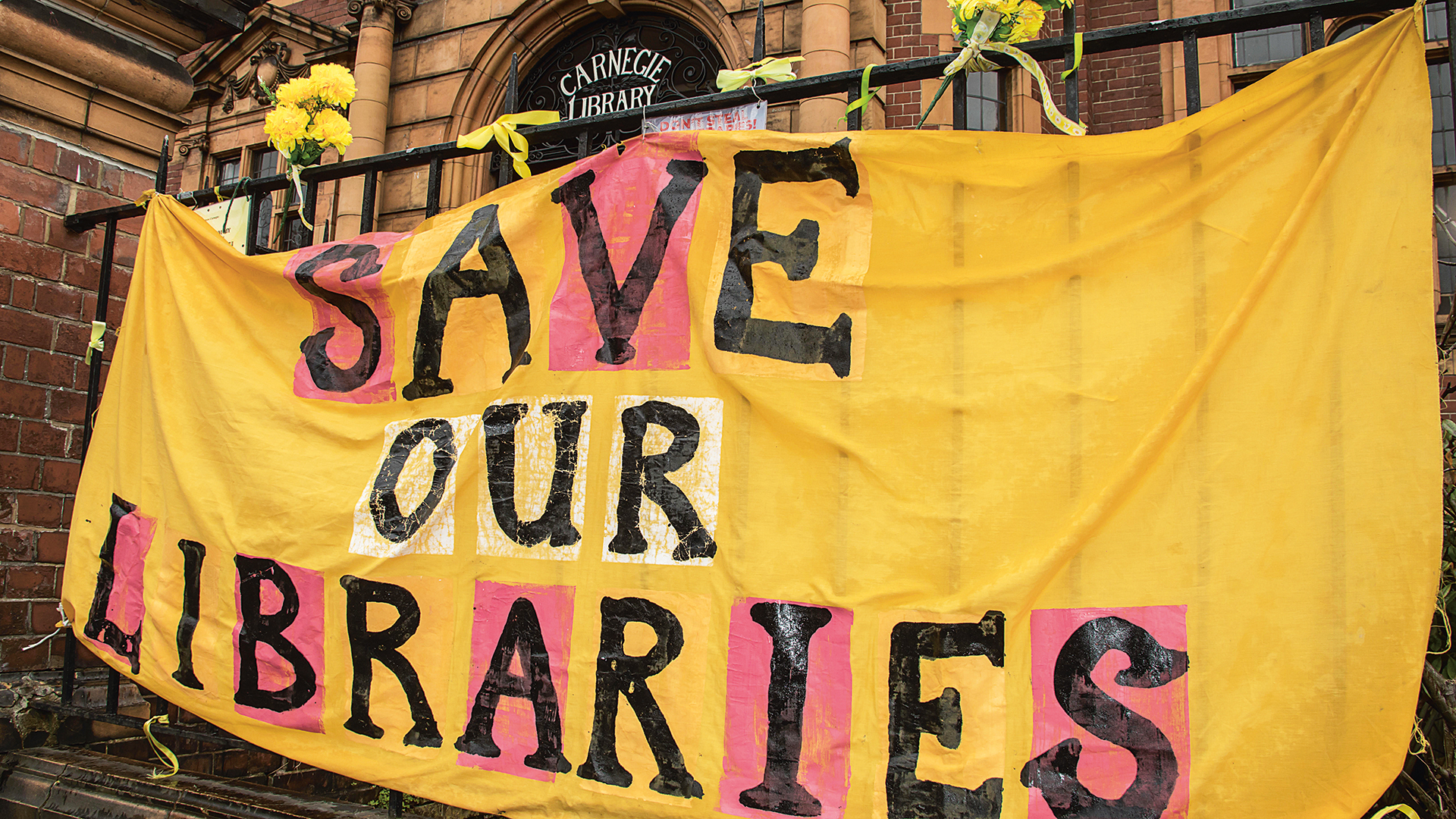 Banner says Save our Libraries