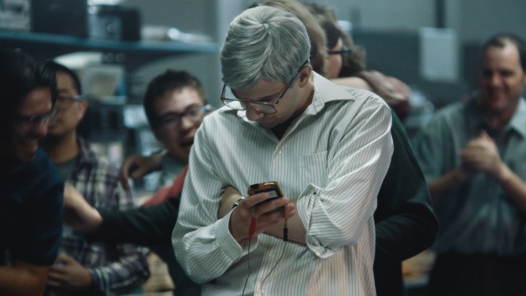 A man looks at his phone