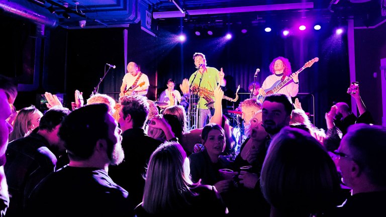 Northern Irish band Anna’s Number on stage in grassroots music venue The Court House, highlighted by Big Issue Venue Watch