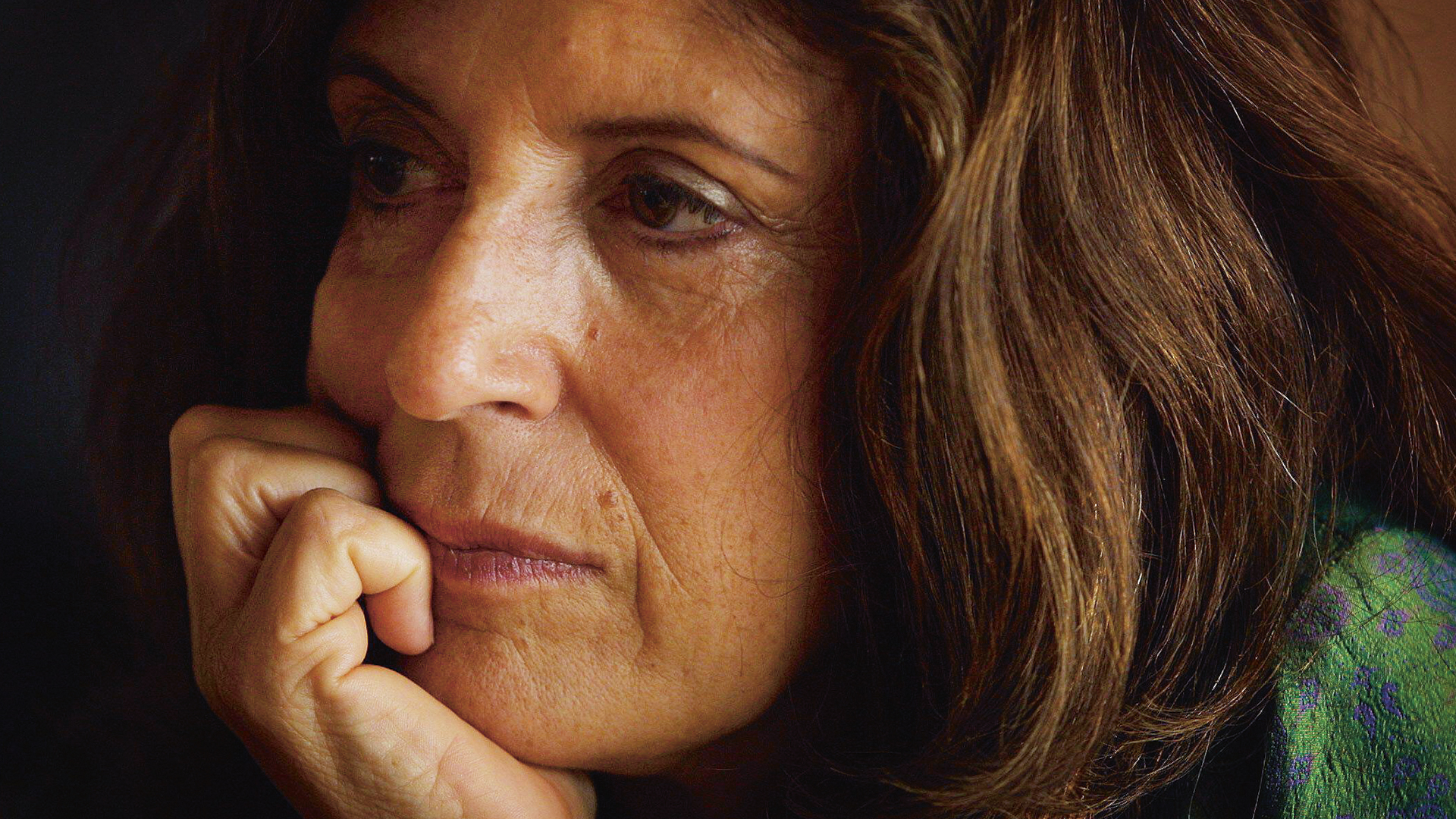 Anita Roddick, chin on hand