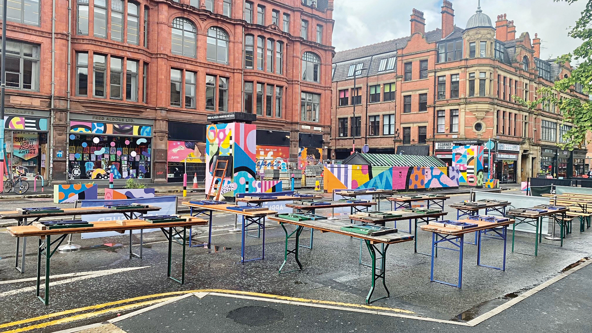 A city square filled with bar tables