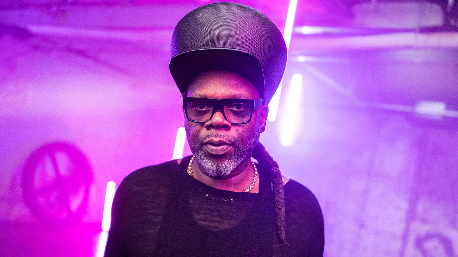 Jazzie B in a black hat