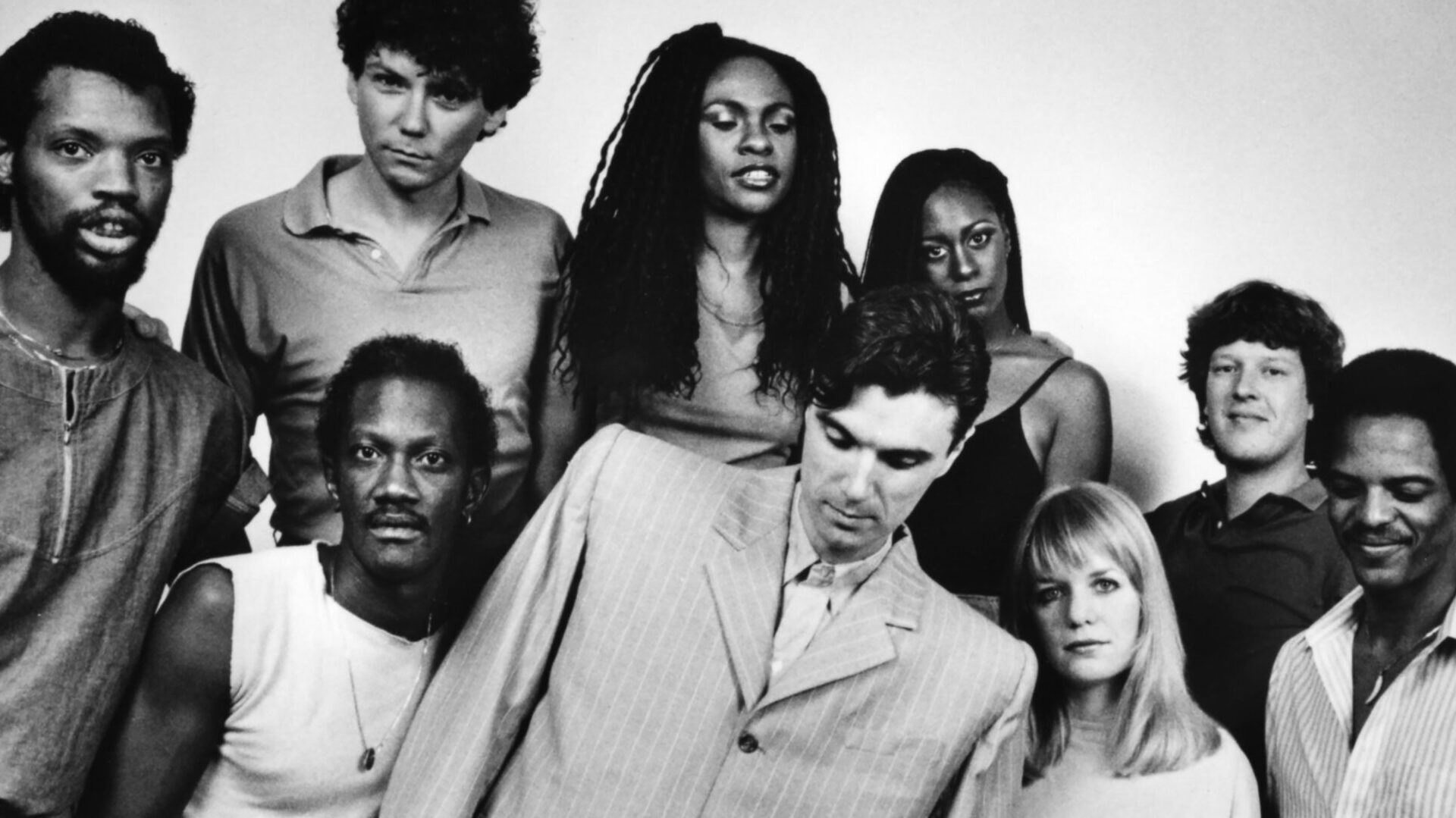 The Talking Heads line-up for the concert film 'Stop Making Sense' (L-R Steve Scales, Bernie Worrell, Jerry Harrison, Ednah Holt, David Byrne, Lynn Mabry, Tina Wemouth, Chris Frantz and Alex Weir)