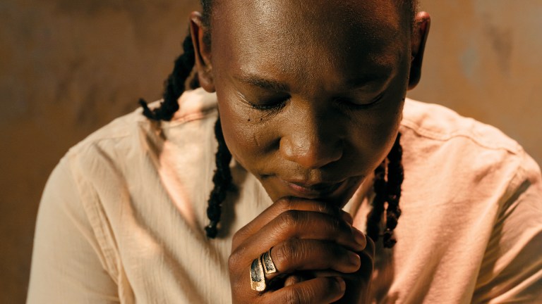 Abel Selaocoe resting his chin on clasped hands