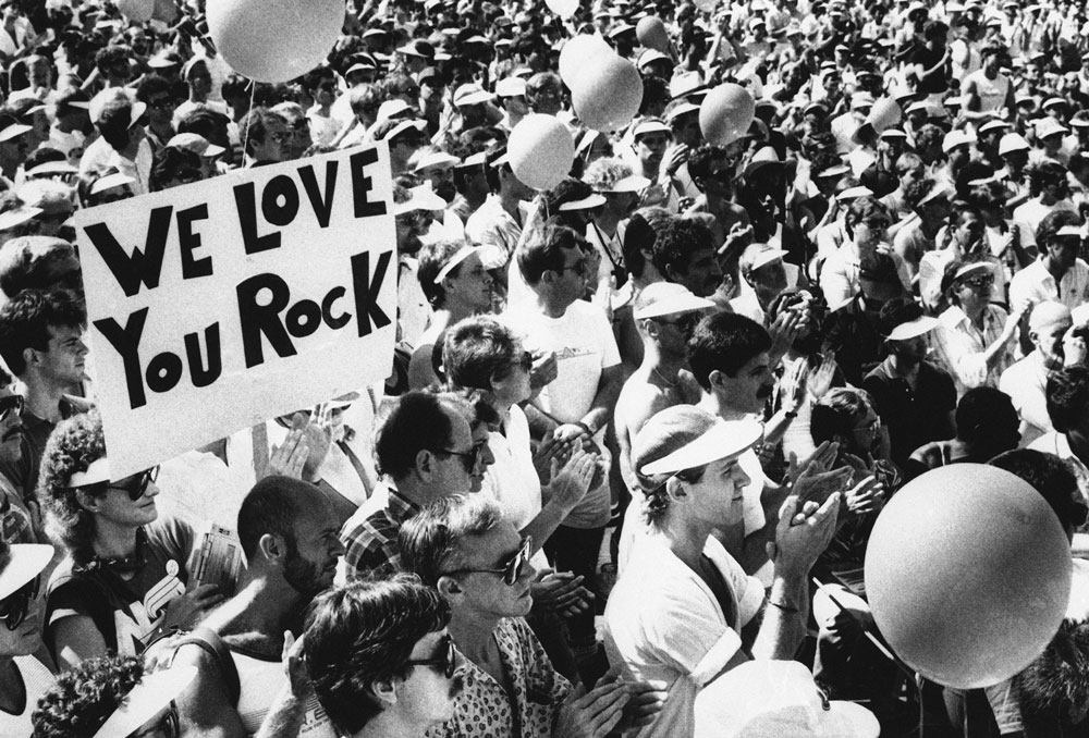 Fans hold up a sign saying: We Love You Rock