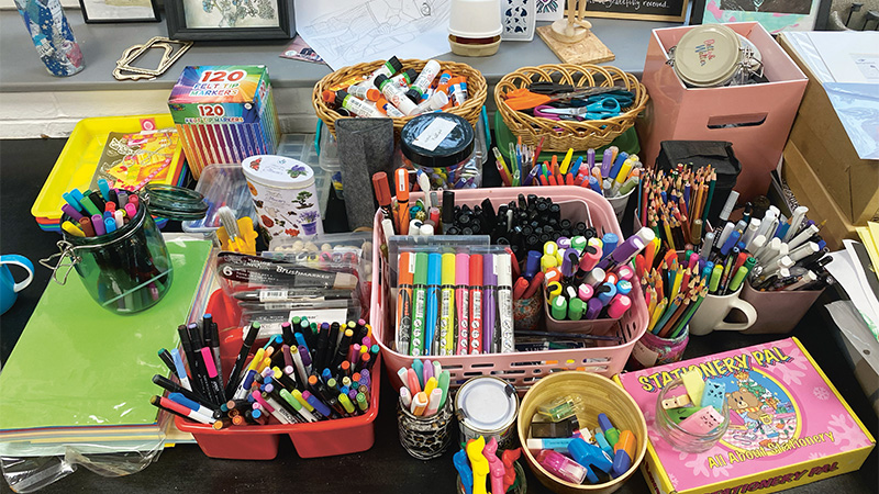 A table filled with art materials