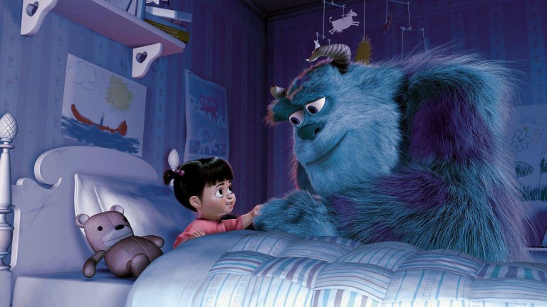 Sulley in Monsters Inc leans over the bed of a child