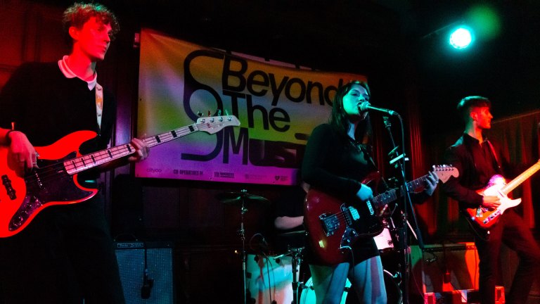 A band onstage at a grassroots music venue