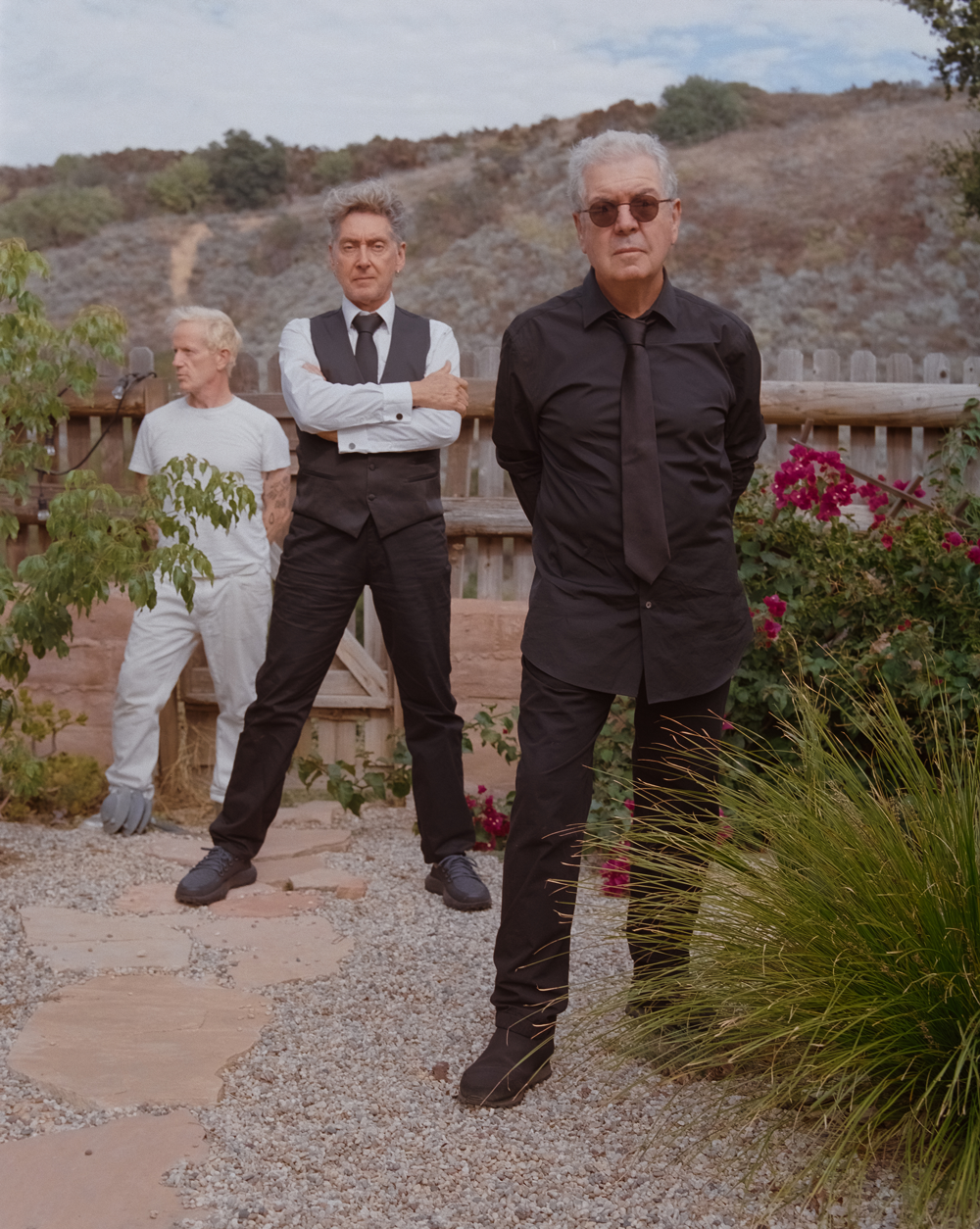 Lol Tolhurst x Budgie x Jacknife Lee standing in the hills around Los Angeles