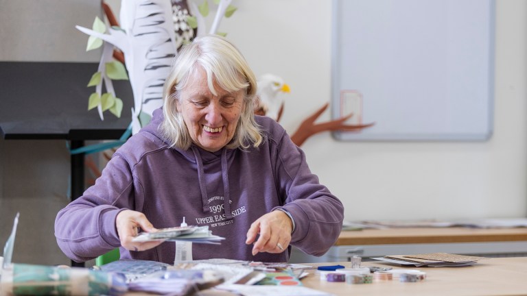 A woman at a library craft class