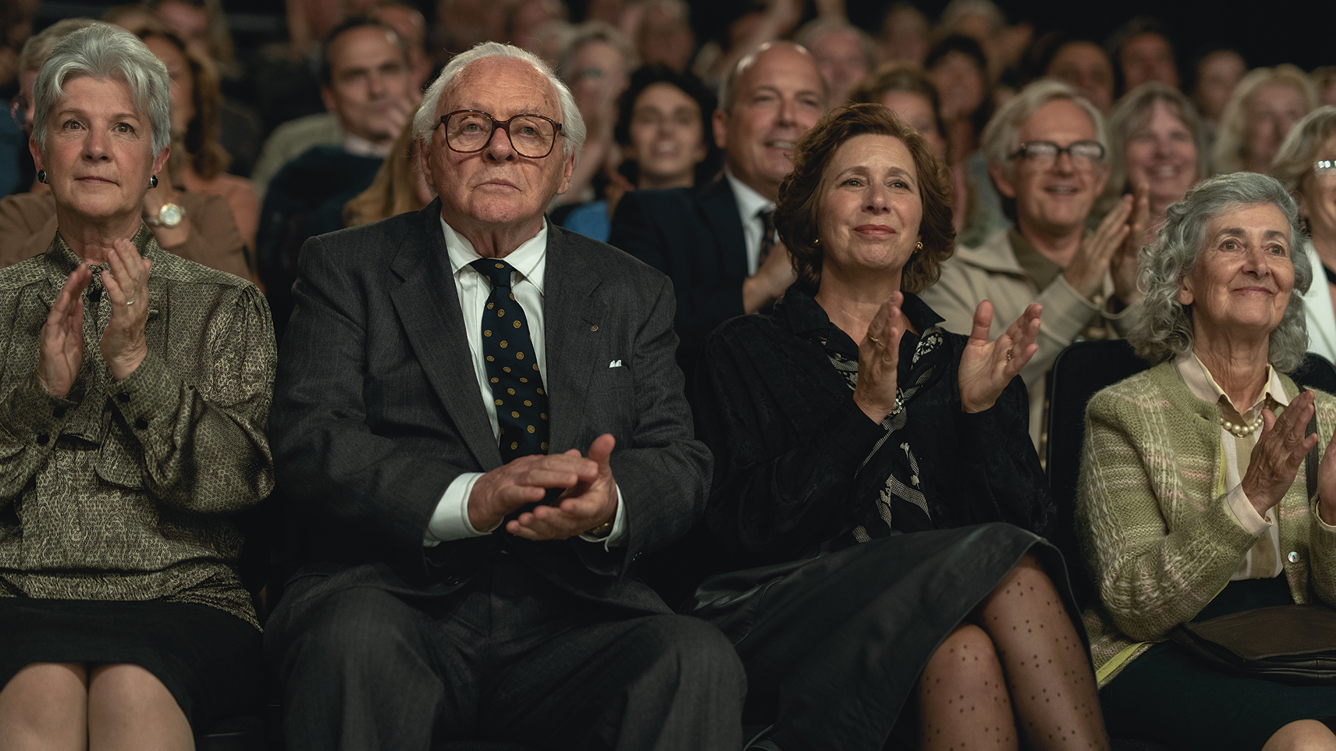 A man sits in an auditorium 