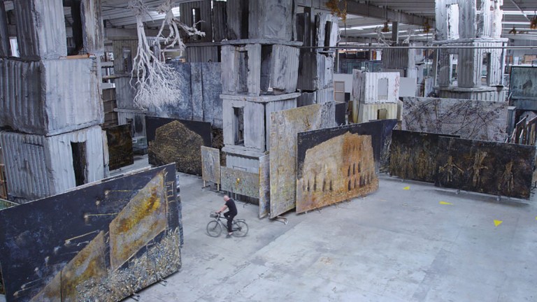 The scale of Kiefer’s artworks is emphasised in a scene in Anselm, in which the artist cycles around his studio in France.