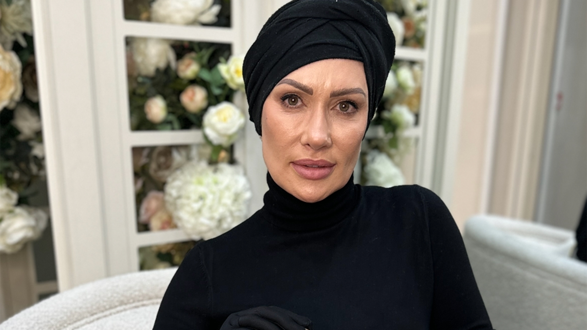 A woman in a black turban