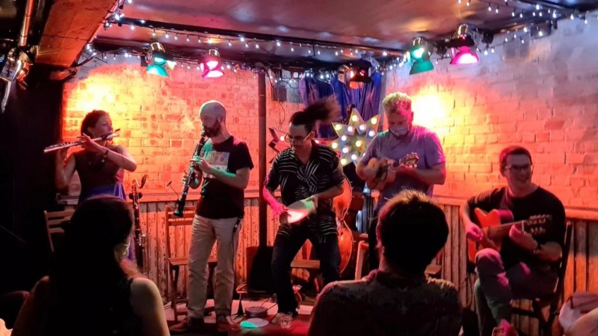 Folk musicians playing at The Harrison in London