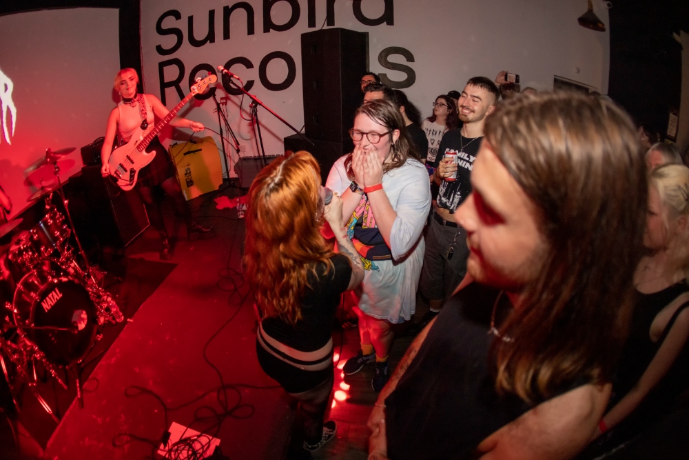 Witch Fever play Sunbird Records to one young woman's delight. Photo: Craig Szlatoszlavek