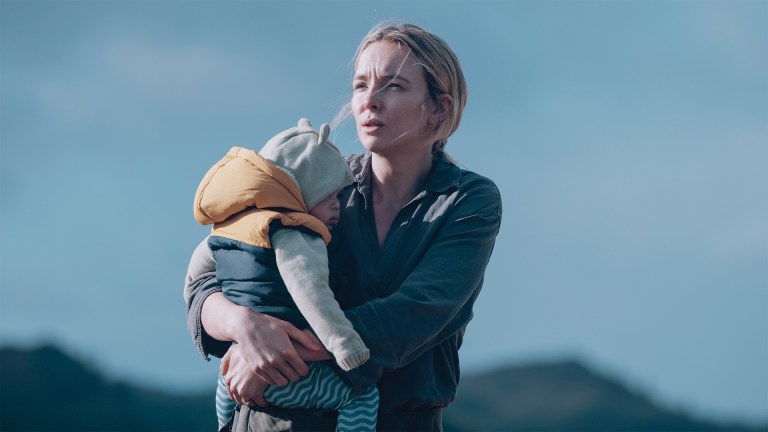 Jodie Comer carrying a baby