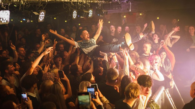 A young man crowdsurfing at The Wardrobe Leeds