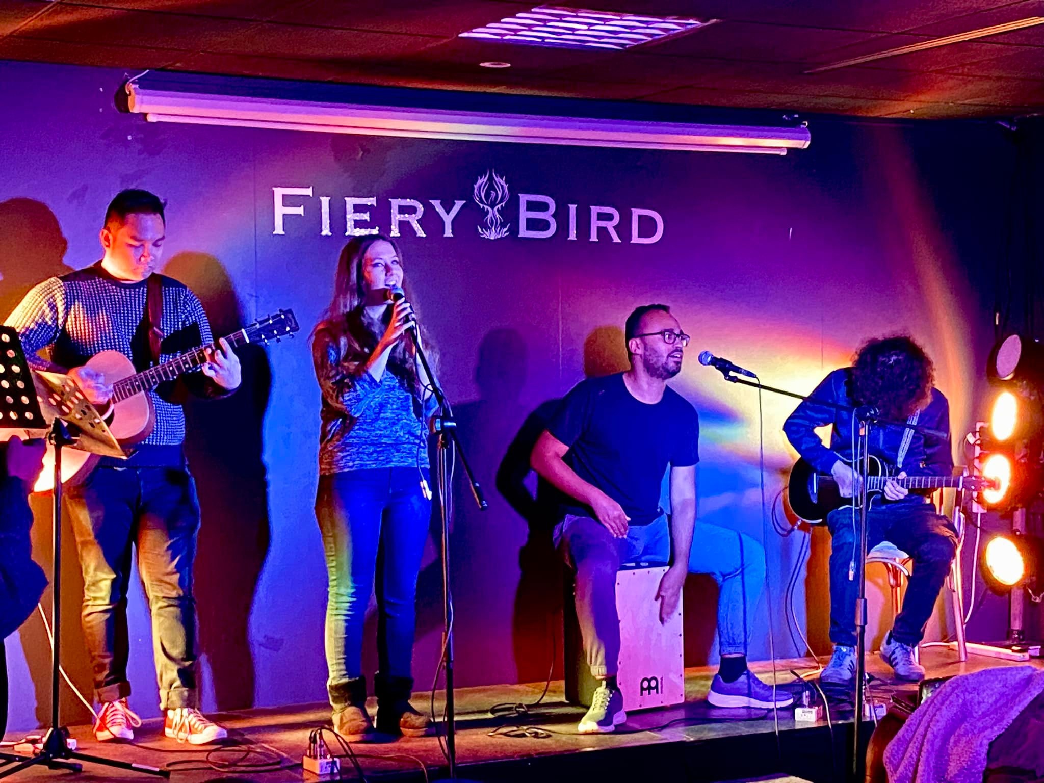 A group of young people jamming original work at Fiery Bird's open mic. Photo courtesy of Phoenix Cultural Centre