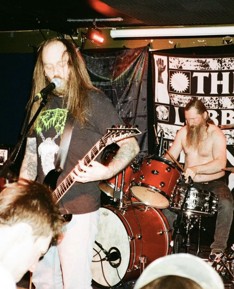 two men playing guitar and drums at the Lubber Fiend