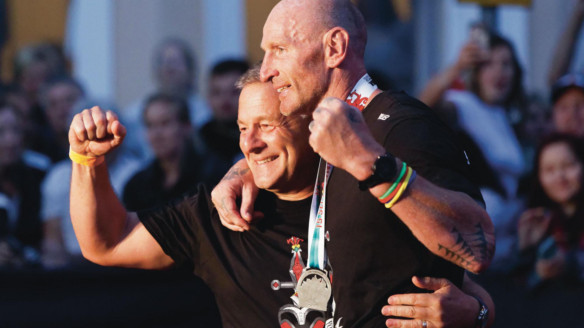 Gareth Edwards with husband Stephen William-Thomas after completing the Ironman triathlon event in Tenby