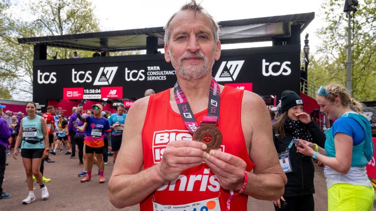 Christopher Eccleston shows his medal after completing the 2024 London Marathon.