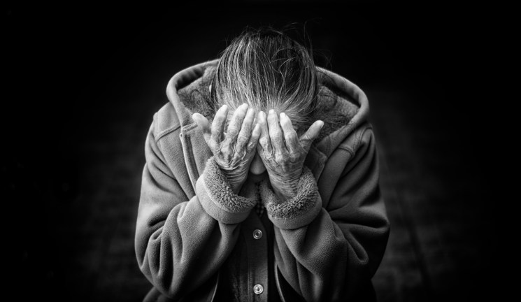 person with head in hands