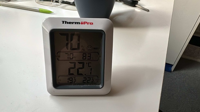 A humidity meter showing 70% on the readout