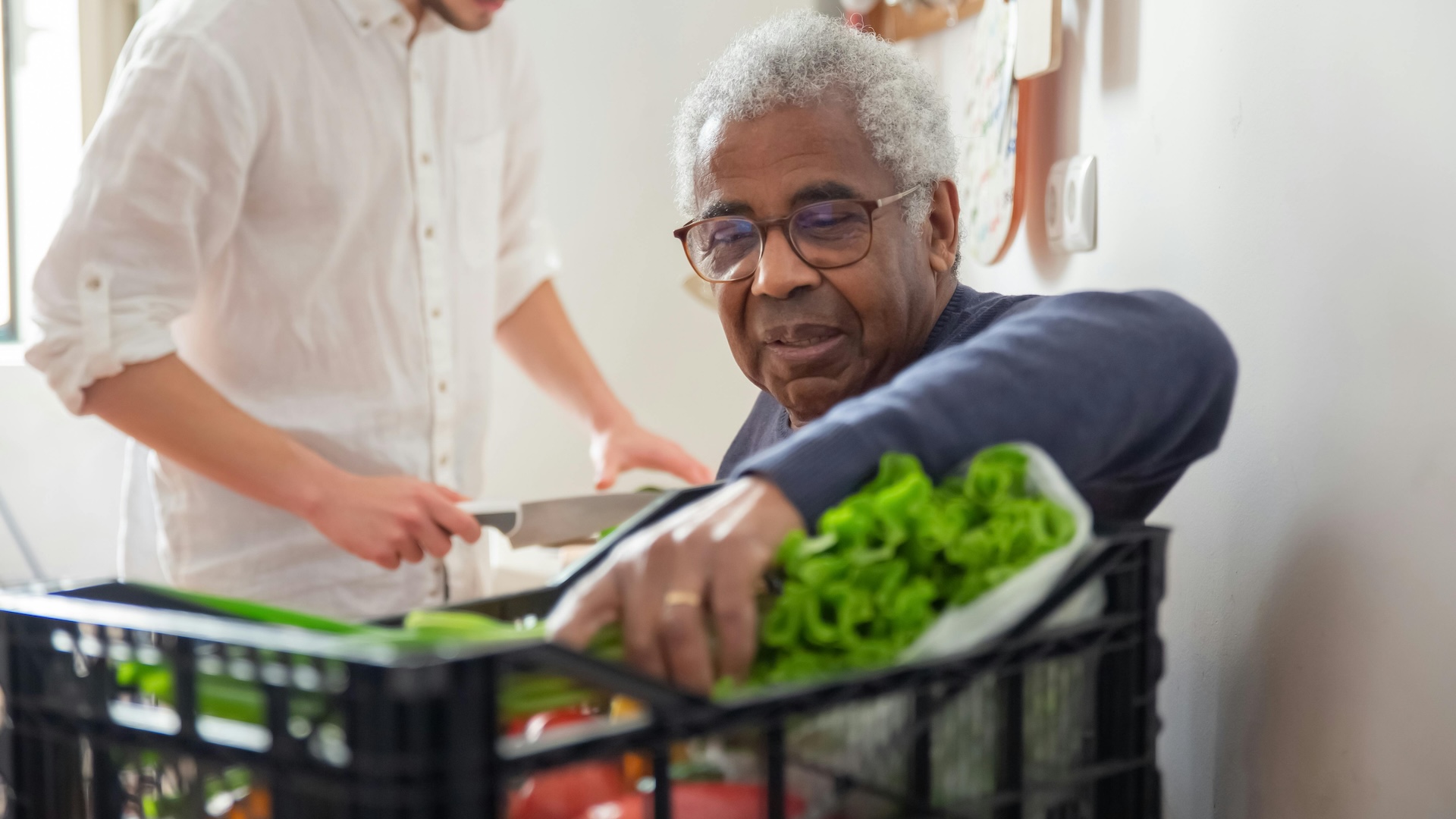 Man looking through food bank basked