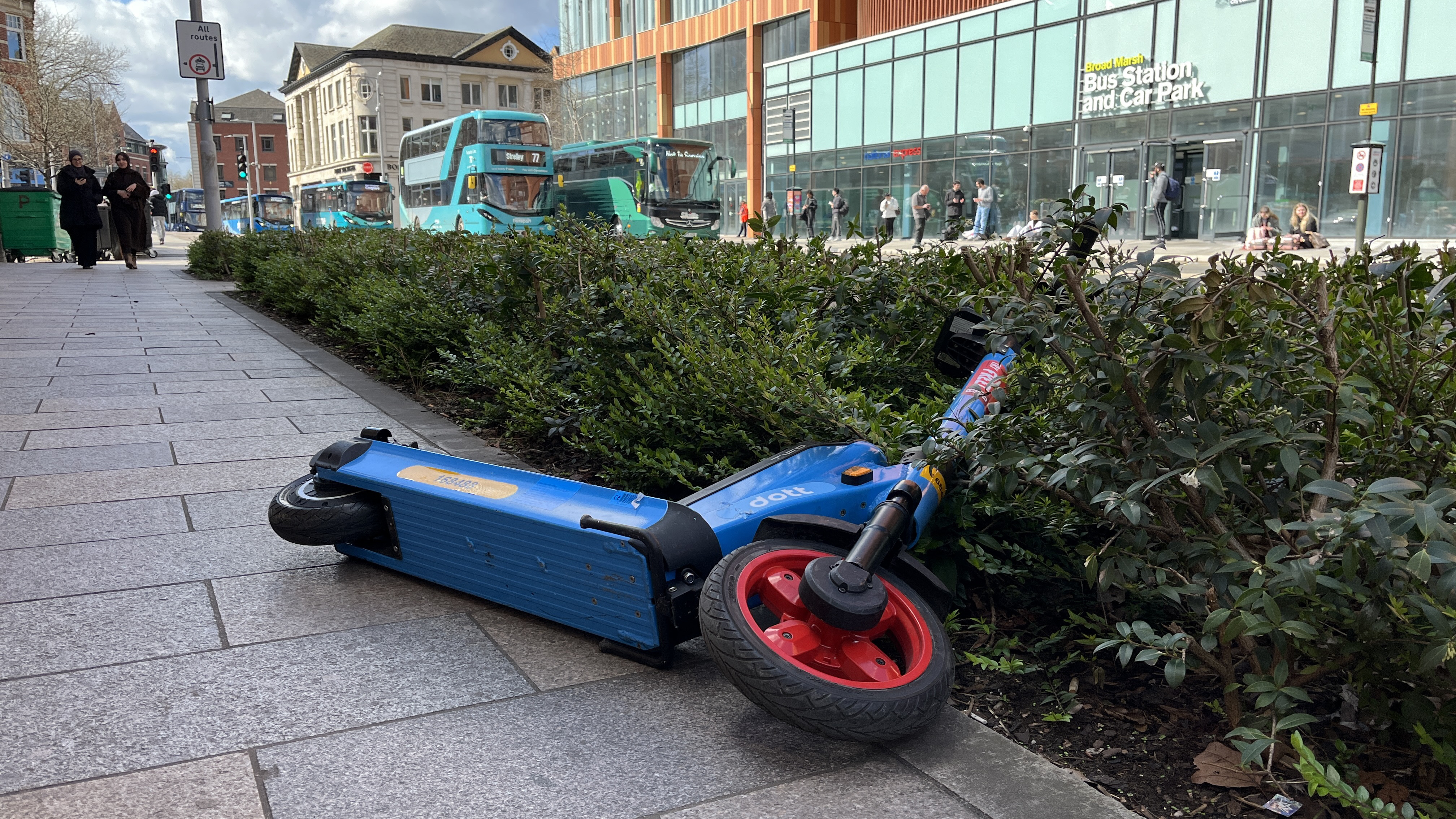 A Dott e-scooter lies discarded on a street in Nottingham.