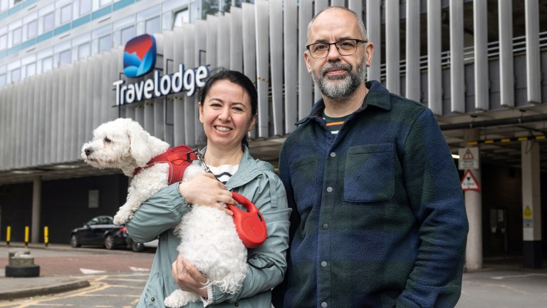A couple in temporary accommodation with a dog