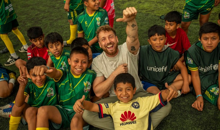 Sam Thompson joined children aged nine to 12 to play football at a UNICEF-supported football programme supporting children in Solola, Guatemala.