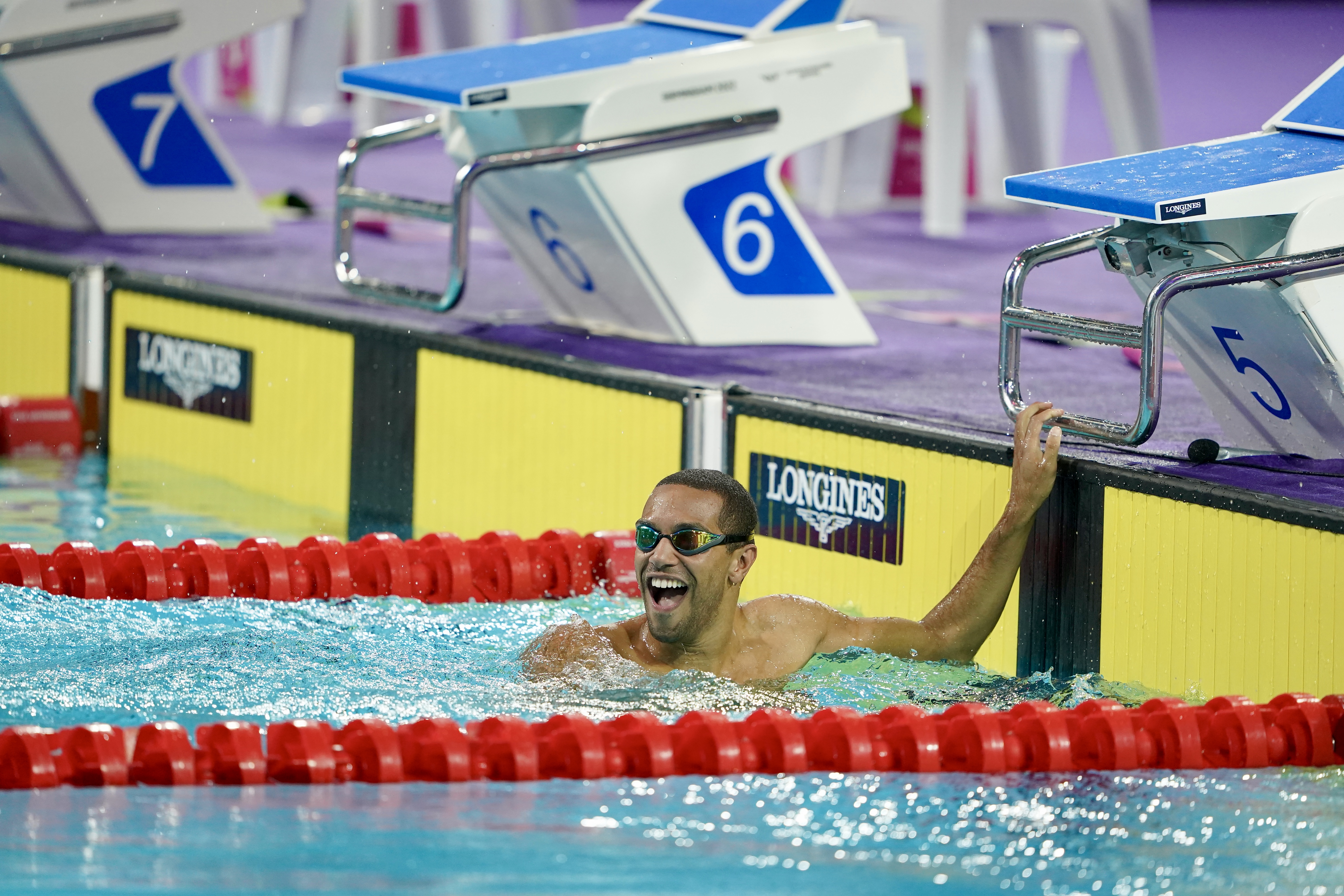 Photo shows Michael Gunning celebrating in the swimming pool after an event