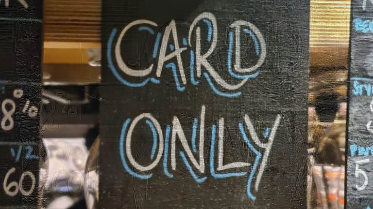 A sign reading 'CARD ONLY'
