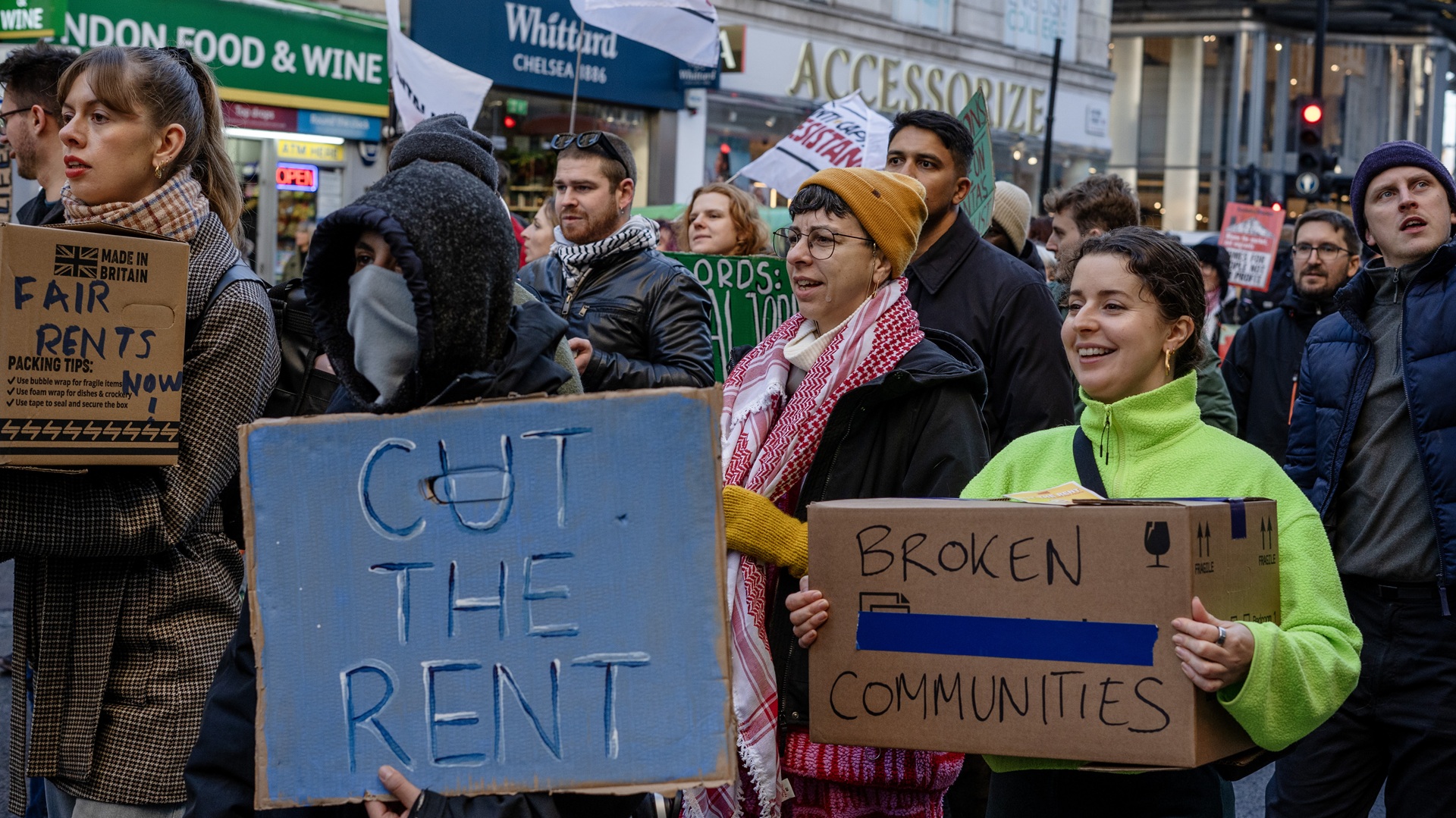 renters protest in London with protesters holding placards