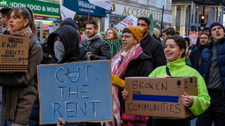 renters protest in London with protesters holding placards