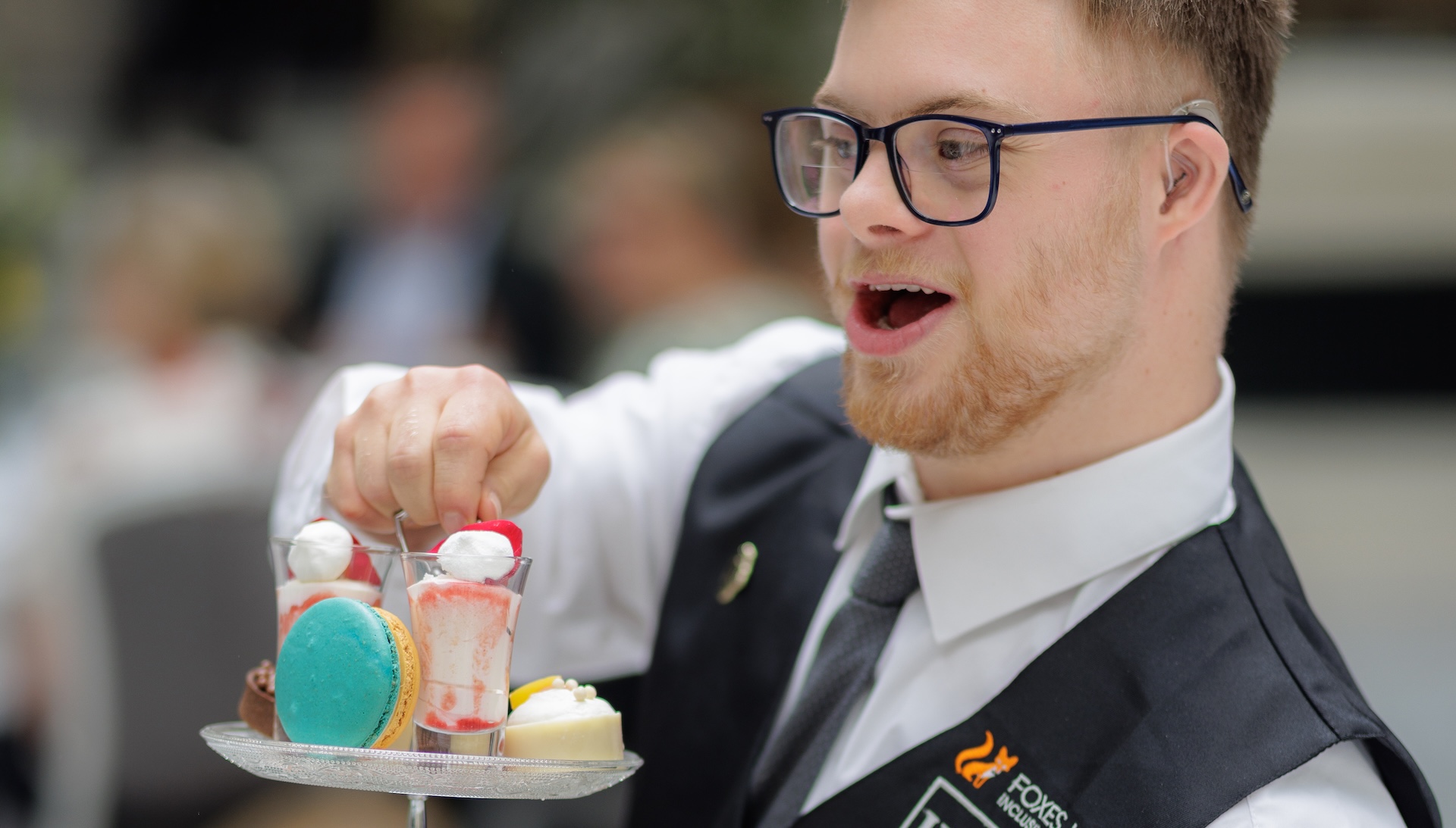 Man serves afternoon tea