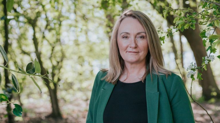Photo of MP Jo Platt against a natural outdoor background