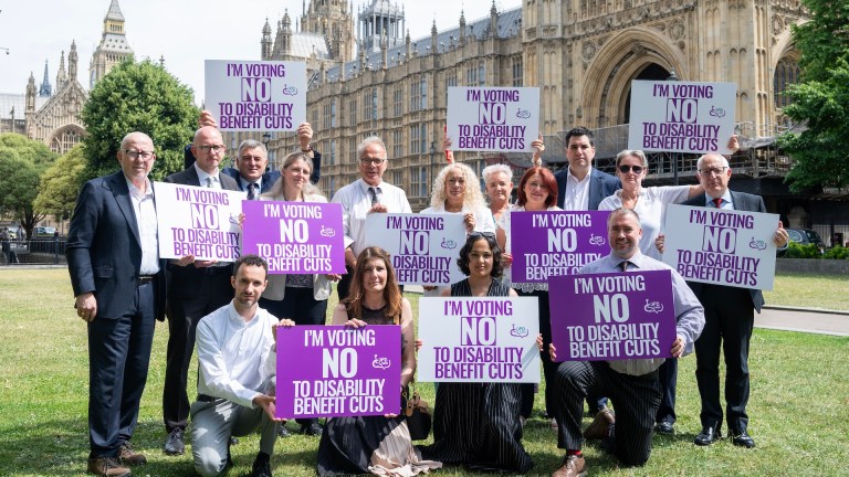 Labour MPs join photo-call to protest against disability benefit cuts.