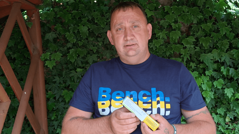 a man holding naloxone which can prevent drug overdoses