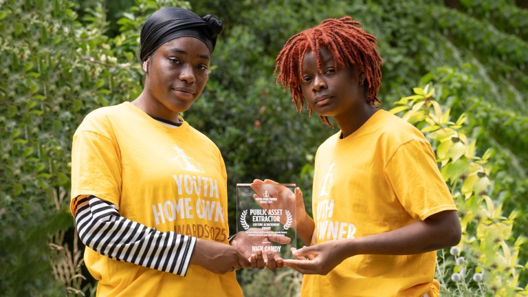 Two activists pictured with a Youth Home Owner Award