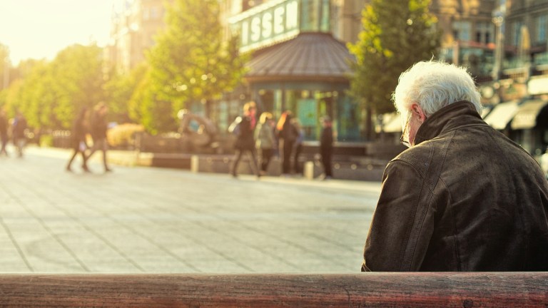 old man sat on bench