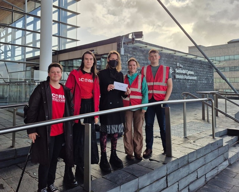 Acorn members hand in their open letter at the Senedd.