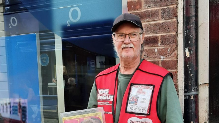 Big Issue vendor Tony Flynn with a copy of the magazine.